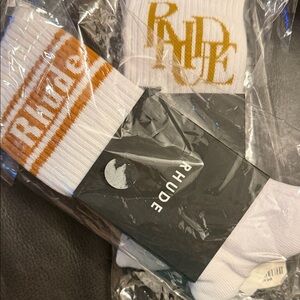One pr Rhude White Crew Socks with Gold Logo and one pr of Racing socks